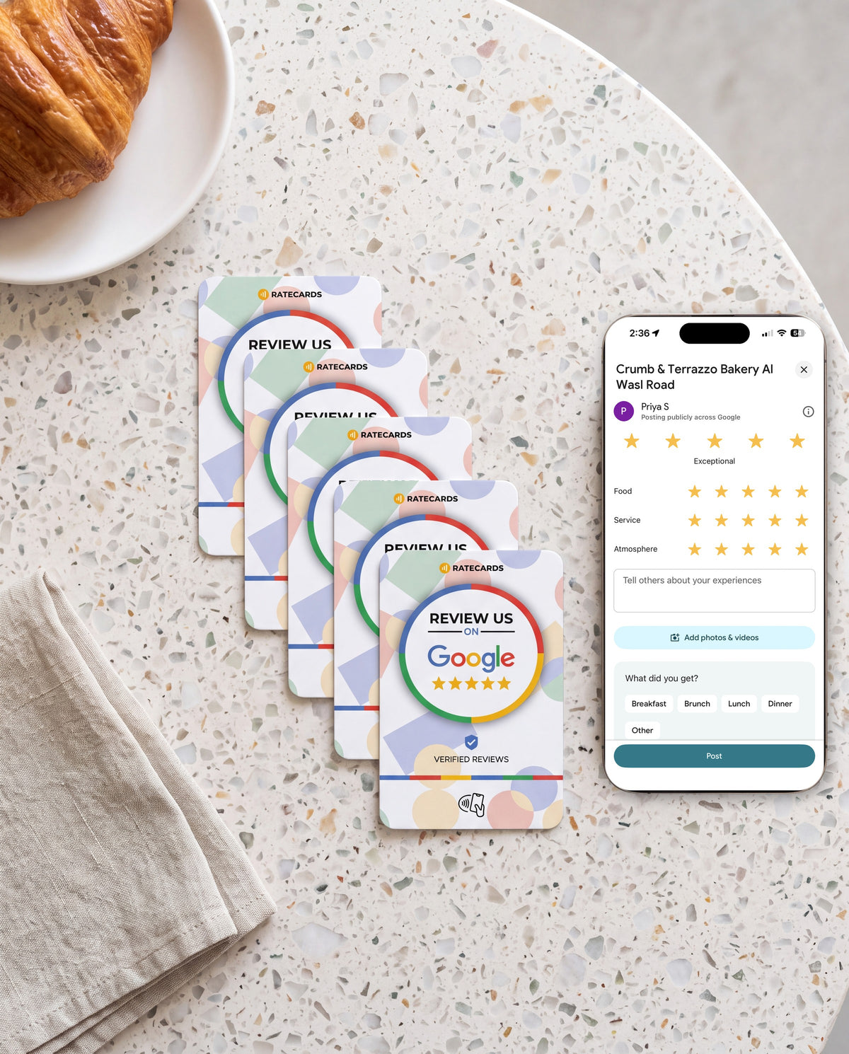 Five RATECARDS Google Review Cards on a bakery counter