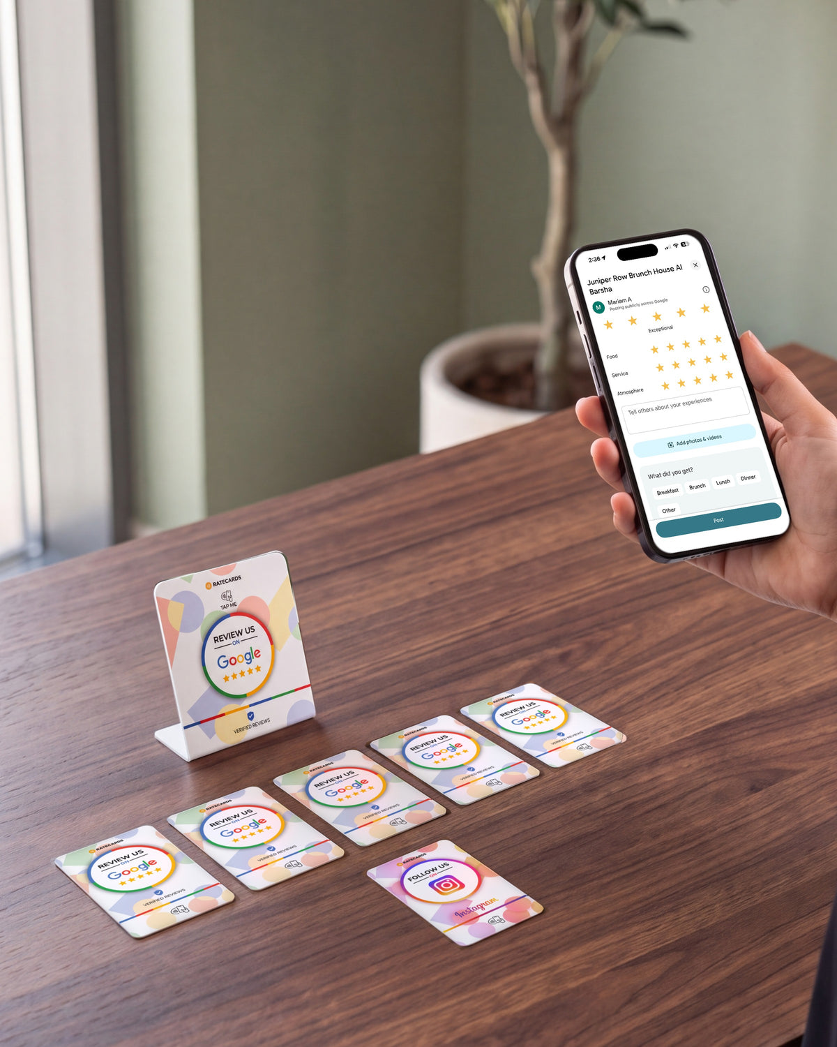 RATECARDS Ultimate Starter Kit on a restaurant host counter: Google Review Stand, five Google Review Cards and an Instagram Card